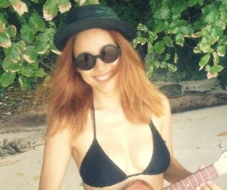 Lee Hyori Looks Cute and Artsy in a Black Bikini