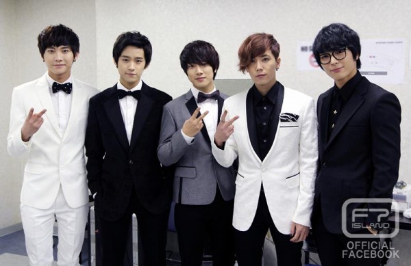 FT Island Donates Books and Computers to School in Africa