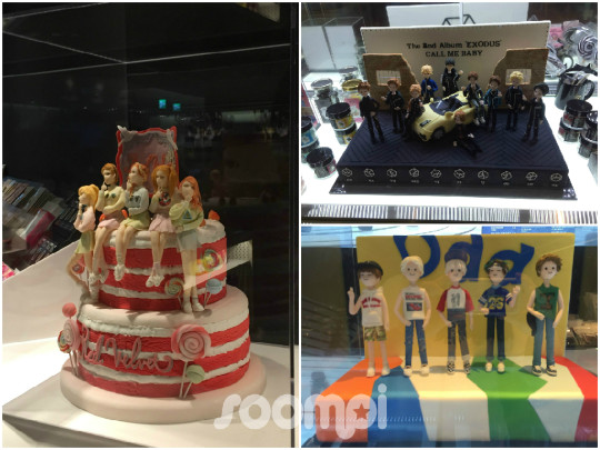 Cute themed cakes on display at the SMTOWN Cafe LIVErary on the fourth floor of COEX Artium in Gangnam Seoul featuring Red Velvet EXO and SHINee character cake designs decorated in each group signature colors
