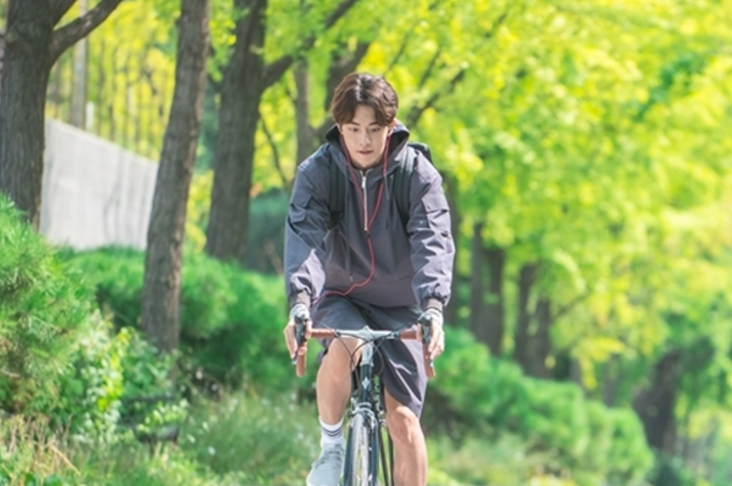 Nam Joo Hyuk Shows Off His Biking Skills In Stills For Upcoming Weightlifting Drama