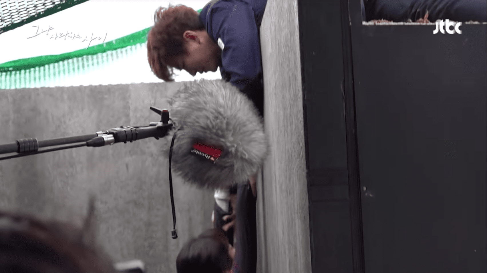 Watch: 2PM's Junho And Won Jin Ah Brave The Cold To Film Realistic Manhole Scene