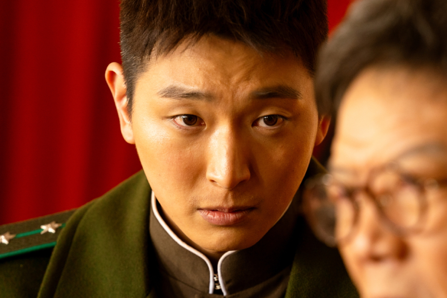2AM’s Jeong Jinwoon Exudes Cold Charisma As A North Korean Captain In New Film “Choir Of God”