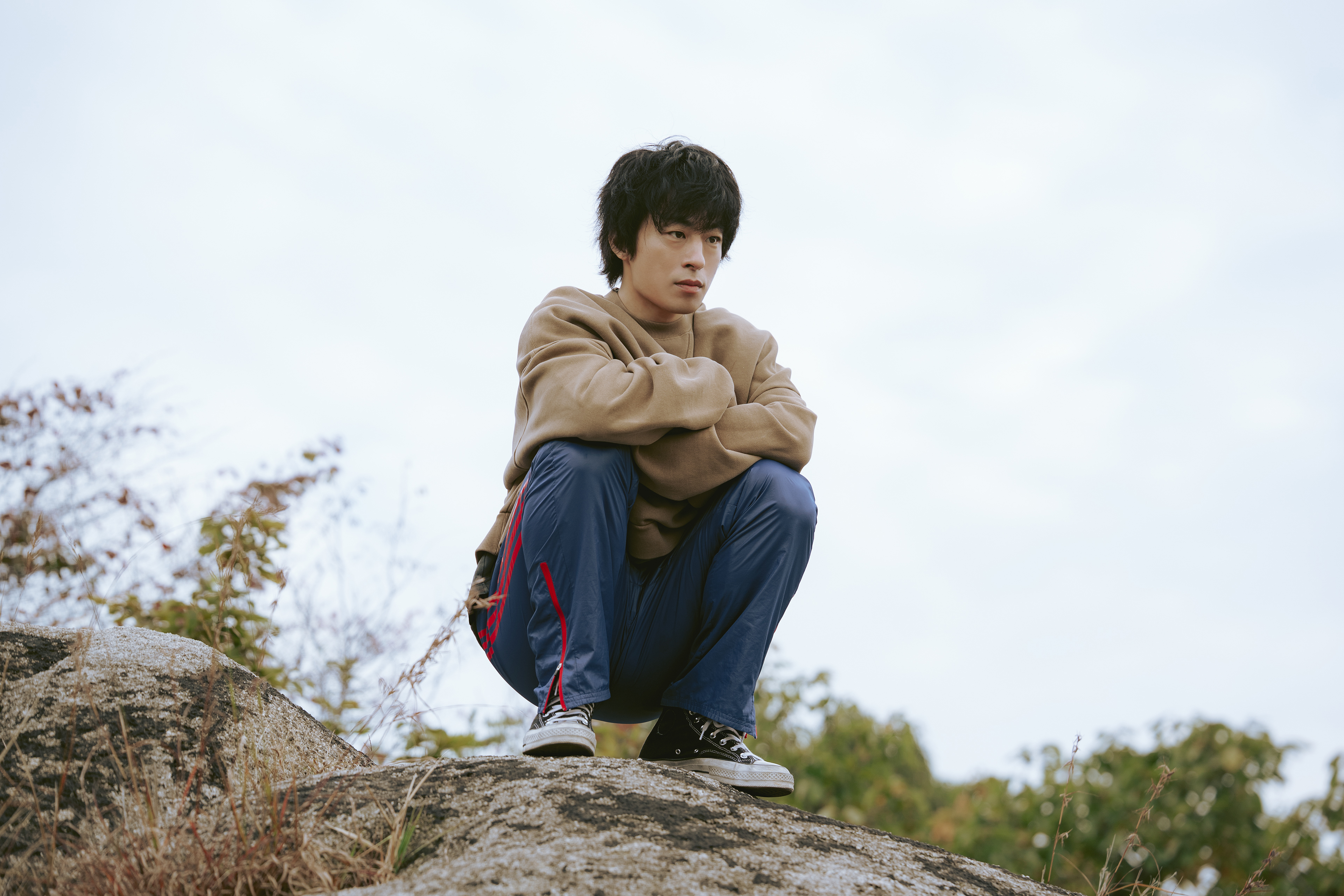 Koo Kyo Hwan as Hwang Dong Man, in a scene that suggests deep contemplation or a moment of vulnerability.