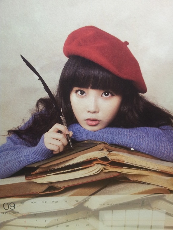 Pictures of IU Singing at a Wedding Show Off Her Thin Figure